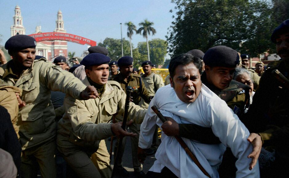 India,New Deli 05.02.2015Father Denny George being dragged by police in front of the Sacred Heart Cathderal in  New Dehli when he attempted to join a demonstration Feb. 5 against the desecration and attacks on five Catholic churches in the Indian capital as well as months of Hindu harassment of Christians throughout the country.)Three policemen tried to drag me away. But I resisted. Then half a dozen of them lifted me upwith one even choking me by the neckand put me in the police bus. His priestly garb gave Father Dennis George little protection, he told international Catholic charity Aid to the Church in Need March 5.